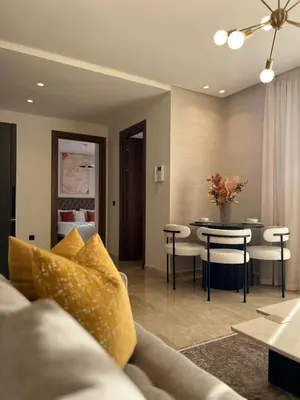 a living room with a couch and a table at Beautiful apartment in Tadart in Casablanca