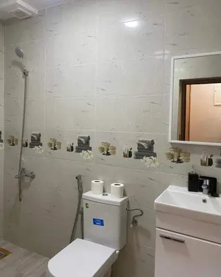 a bathroom with a toilet and a sink and a mirror at Riad sultan in Casablanca