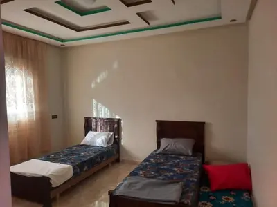 a bedroom with two beds and a ceiling at Riad sultan in Casablanca