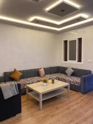 a living room with a couch and a coffee table at Riad sultan in Casablanca