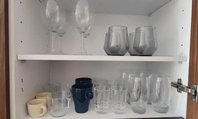 a bunch of glasses sitting on a shelf at HSuites Casablanca, Suite H Prime, Elegant one bedroom apartment in Casablanca