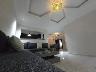 a living room with a couch and a table at Faridi house in Casablanca