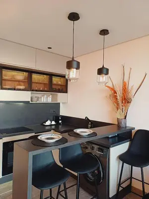 a kitchen with a island with two plates on it at Panoramic ocean view appartement in Casablanca