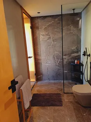 a bathroom with a shower and a toilet at Panoramic ocean view appartement in Casablanca
