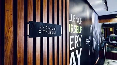 a door with a sign on a wooden wall at Apartment with GYM ! Private parking in Casablanca