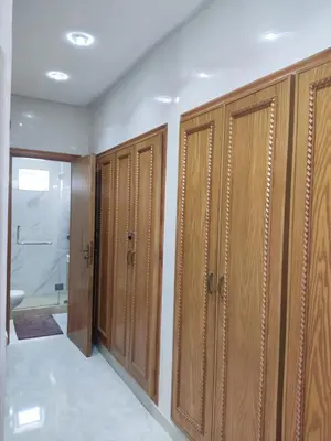 a row of wooden lockers in a bathroom at Wafa in Casablanca