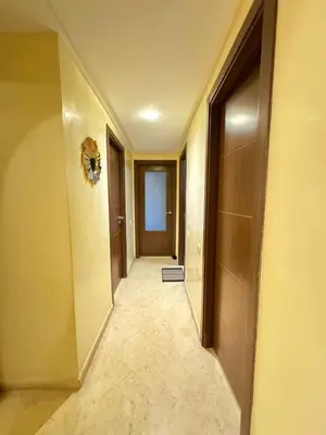 an empty hallway with a door and a hallwayngth at Jardin mohammedia in Mohammedia