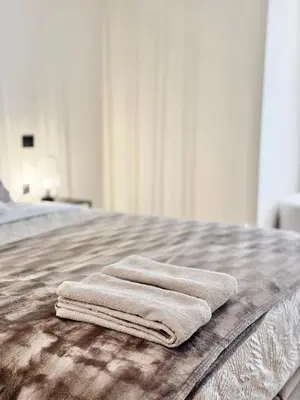 a group of towels sitting on top of a bed at Appartement Oasis in Casablanca