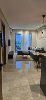 a living room with a couch and a table at Appartement Oasis in Casablanca