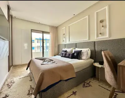 a bedroom with a bed and a window at Kawtar in Mansouria
