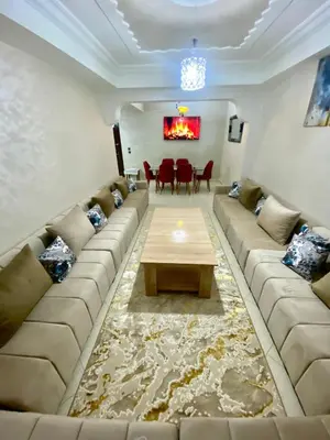 a living room with a large couch and a table at casa bella in Casablanca