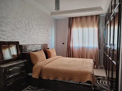 a bedroom with a large bed and a window at casa bella in Casablanca