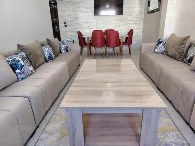 a living room with a couch and a table at casa bella in Casablanca