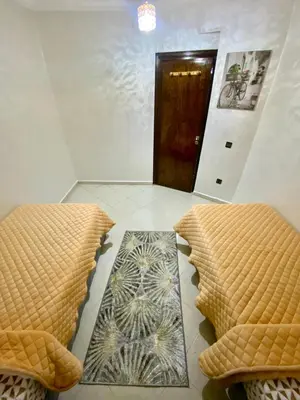 a room with two beds and a door at casa bella in Casablanca