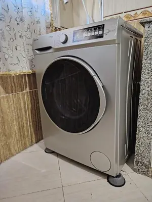 a washing machine is sitting on a floor at casa bella in Casablanca