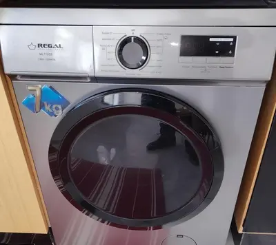 a washing machine with its door open in a kitchen at Your comfortable stopover in Nouaseur