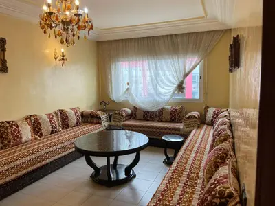 a living room with a couch and a table at Dar dyafa in Casablanca