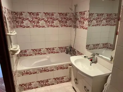 a bathroom with a tub and a sink at Dar dyafa in Casablanca