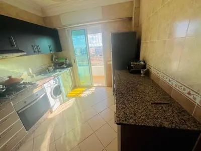 a kitchen with a sink and a dishwasher at Apparemment à louer au centre ville Bouznika in Bouznika
