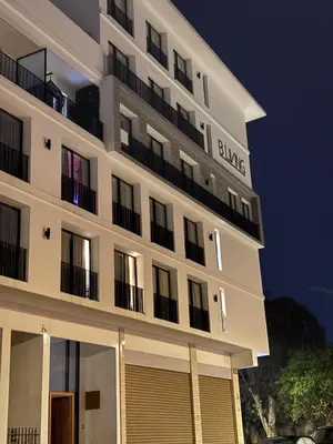 a large white building with a sign on it at Modern apartment in Casablanca in Casablanca