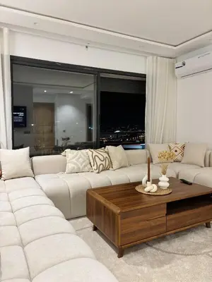 a living room with a white couch and a coffee table at Beautiful spacious apartment in Casablanca in Casablanca