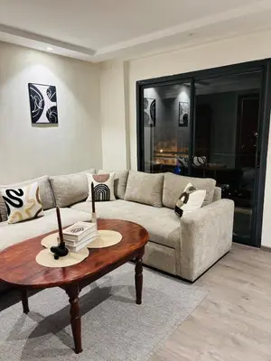 a living room with a couch and a coffee table at Beautiful spacious apartment in Casablanca in Casablanca