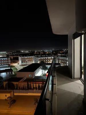 a view of a city at night from a balcony at Beautiful spacious apartment in Casablanca in Casablanca