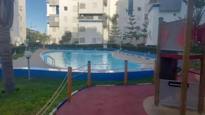 a swimming pool with a slide in a building at La passage inoubliable F in Bouznika