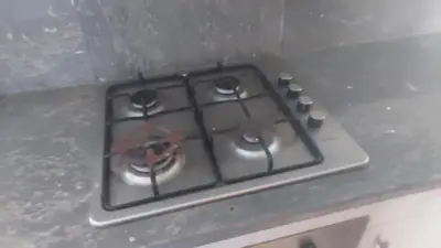 a stove top with a bunch of burners on it at La passage inoubliable F in Bouznika
