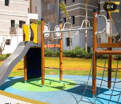 a playground with a slide in a park at Résidence fal green bouskoura in Bouskoura
