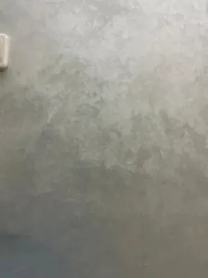 a gray concrete wall with a lot of water at Sekina logement in Casablanca