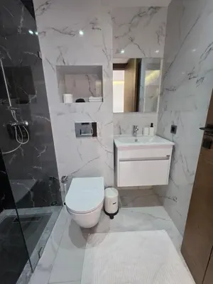a bathroom with a toilet and a sink and a shower at Résidence EDEN 4 - Casablanca Center in Casablanca