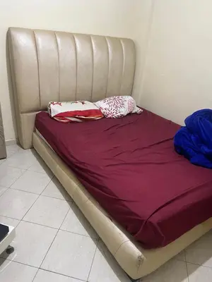 a bed with purple sheets and pillows on it at Appartement farah salam oulfa in Casablanca