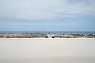 a large body of water with a building in the background at Studio Raffiné et Lumineux in Casablanca