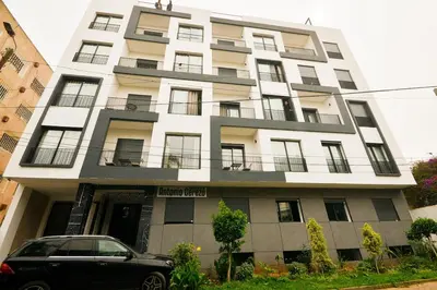 a building with a car parked in front of it at Atelier Aedes - Studio 2 in Maarif