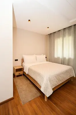 a bedroom with a large bed and a window at Atelier Aedes - Studio 2 in Maarif