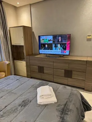 a bedroom with a bed and a tv on a cabinet at Nice Studio rabat in Rabat