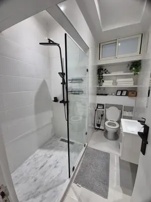 a bathroom with a shower and a toilet at Studio close to Descartes high school in Rabat