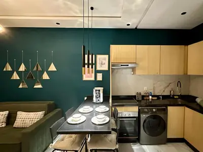 a kitchen with a table with plates on it at CosmoStay Airport Casablanca Appart in Nouaseur