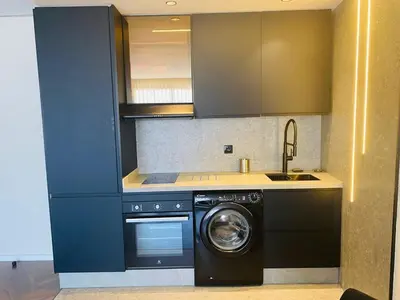 a kitchen with a washing machine and a dishwasher at spectrum studio in Casablanca