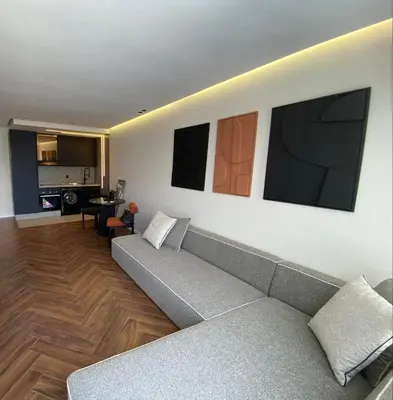 a living room with a couch and some pictures on the wall at spectrum studio in Casablanca