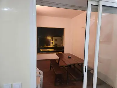 a dining room with a table and a window at Apartment Ocean View in O Ben Slimane