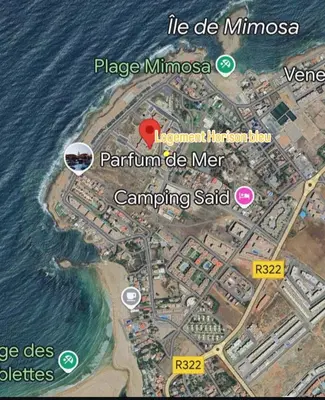 a map of a city and the ocean at Apartment with pool view, 1 min to beach, private parking in Mansouria