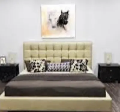 a bedroom with a large bed with a large headboard at Appartement CFC vue sur mer et sur la ville in Anfa