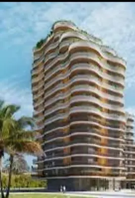 a tall building with a tree on top of it at Appartement CFC vue sur mer et sur la ville in Anfa