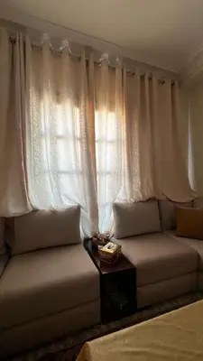 a living room with a couch and a window at La maison in Casablanca