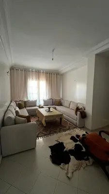 a living room with a cow laying on the floor at La maison in Casablanca
