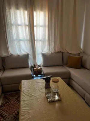 a living room with a couch and a coffee table at La maison in Casablanca