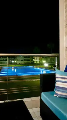 a view of a tennis court at night at Ola Blanca in Sidi Rahal