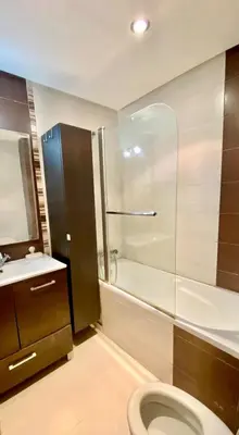 a bathroom with a toilet and a shower and a sink at Ola Blanca in Sidi Rahal